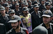 Iranian Revolutionary Guards take part in a demonstration in Tehran in 2006. A prominent Iranian dissident who co-founded the elite Revolutionary Guards said that the United States risks elevating tensions and is not likely to achieve much by declaring Iran's Revolutionary Guards a 
